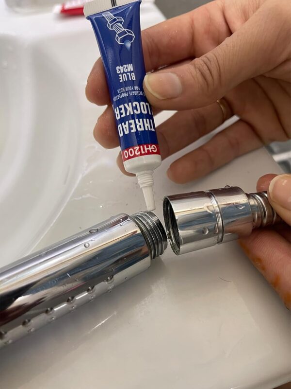 Close-up of GH1200 blue thread locker being applied to threaded pipe for leak-proof, vibration-resistant seal